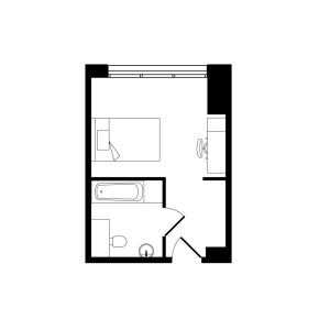 Compact and efficient studio apartment floor plan featuring a cozy bedroom area and modern bathroom layout.