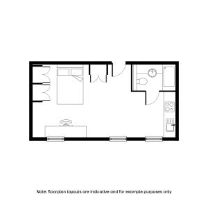 Elegant apartment floor plan showcasing a spacious studio layout with a bedroom, modern kitchenette, and stylish bathroom.